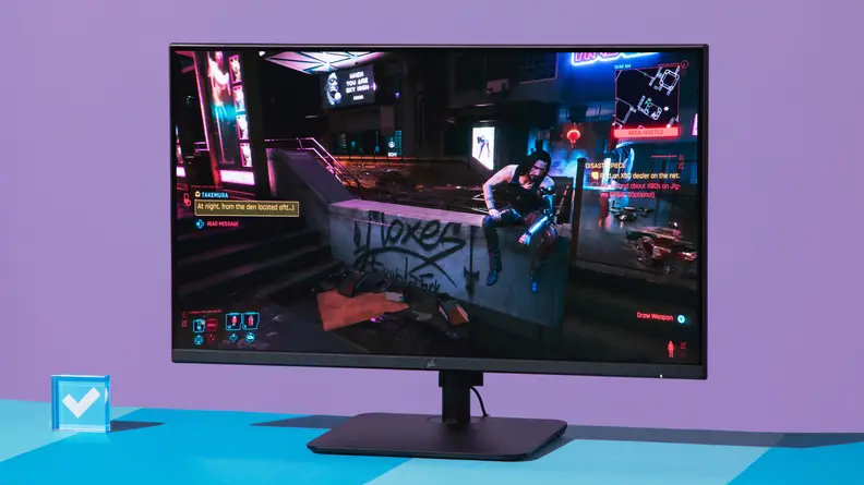 The monitor displaying Cyberpunk 2077.