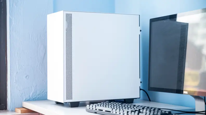 The PC sits on the left side of a desk
