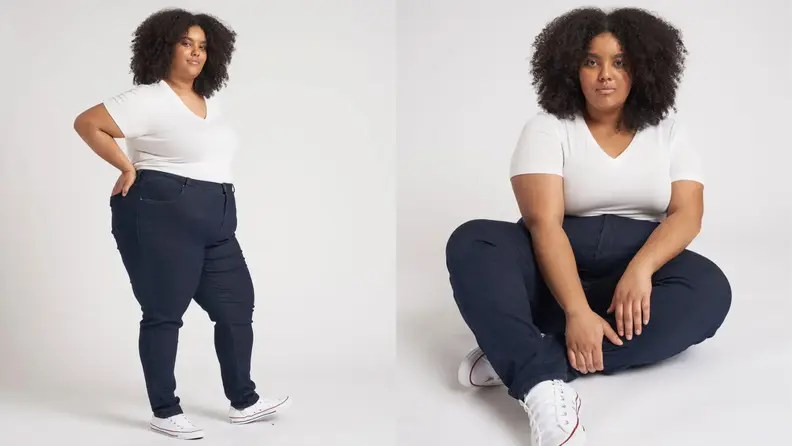 Left: Black US model wearing white tshirt and Seine dark blue skinny jeans standing sideways with hand on hips in front of a grey background, Right: same model sitting on the floor crosslegged in front of a grey background