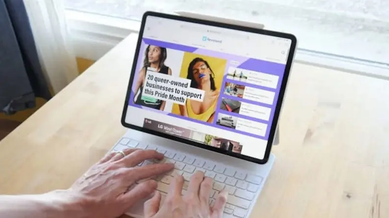 Image of person typing on laptop