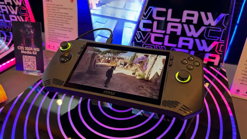 An MSI Claw on display in a vibrant purple setup at CES 2024.