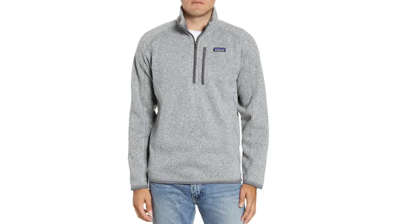 A person wears a gray sweater.