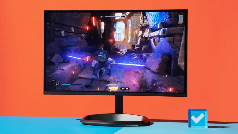 Product shot of the Cooler Master Tempest GP27Q gaming monitor on top of blue surface.