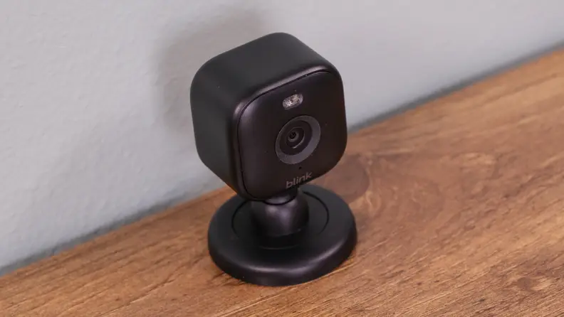 The Blink Mini 2 set up by a wall.