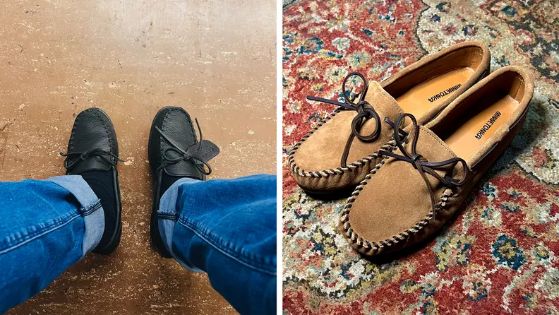 A man wearing blue shoes with jeans and also a pair of brown moccasins on a rug.