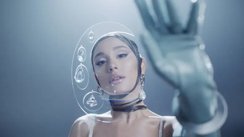 Ariana Grande reaching toward the camera.