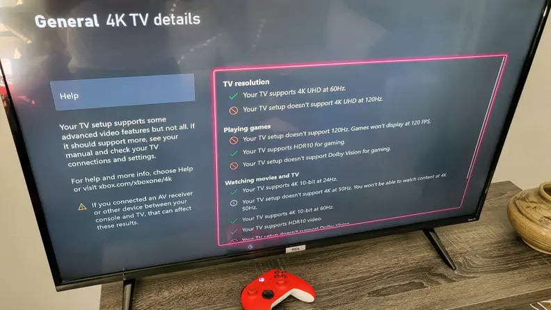 The TCL 4-Series displaying its gaming statistics from an Xbox Series X