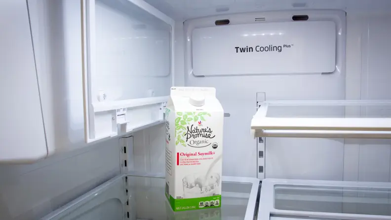 The shelf on the left folds back to make room for tall containers