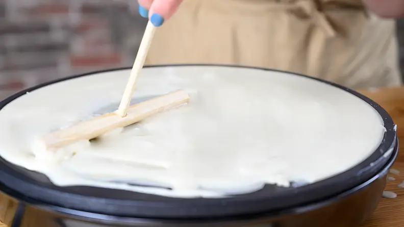 Make sure not to break the crepe while spreading it counterclockwise.