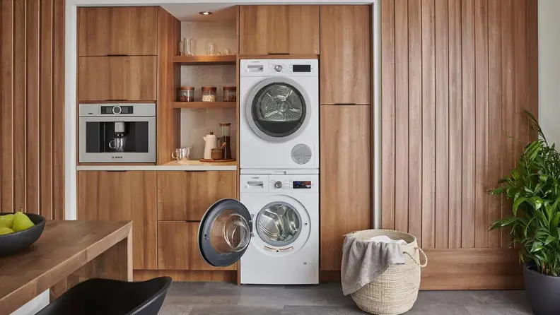 Modern washer and dryer set from Bosch in kitchen.