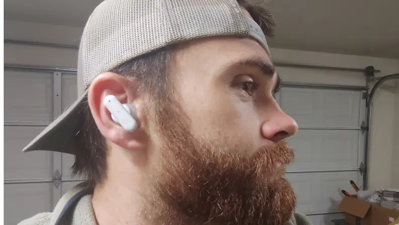Close-up of the author's face sporting the earbuds.