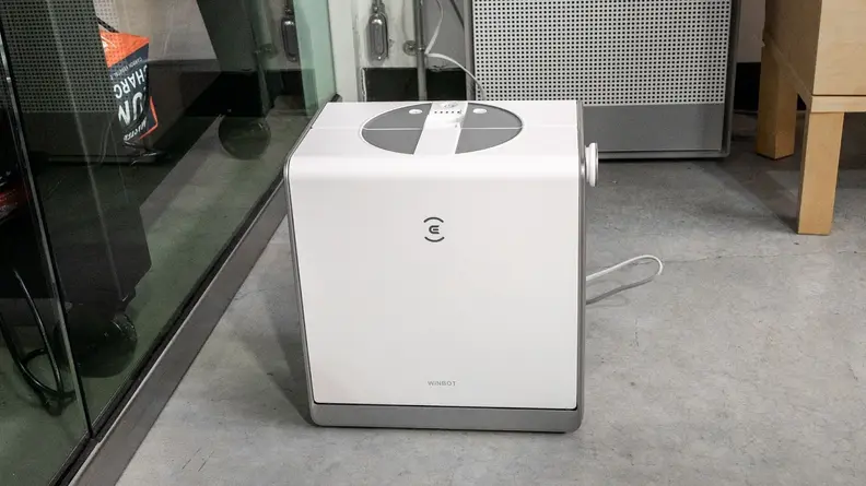 The Ecovacs Winbot W2 Omni in its carrying case