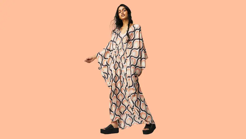 A flowing, printed caftan-style dress.
