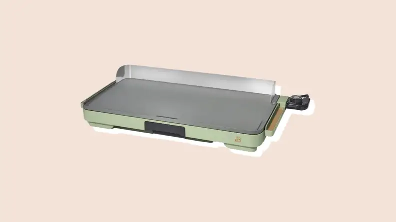 Product shot of jade green colored countertop griddle from the Beautiful by Drew Barrymore Kitchen Appliances line.