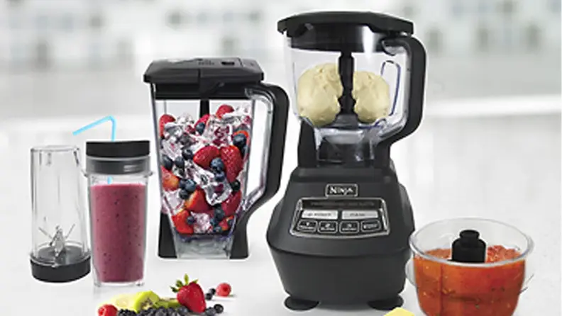 A Ninja blender system on a kitchen counter.