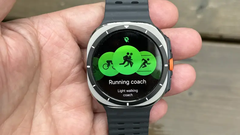 Person holding the Samsung Galaxy Watch Ultra in their fingers.