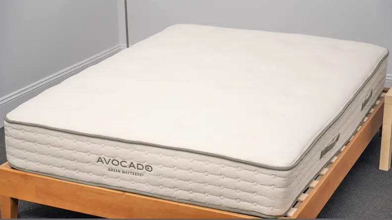 the avocado mattress on a brown bed frame