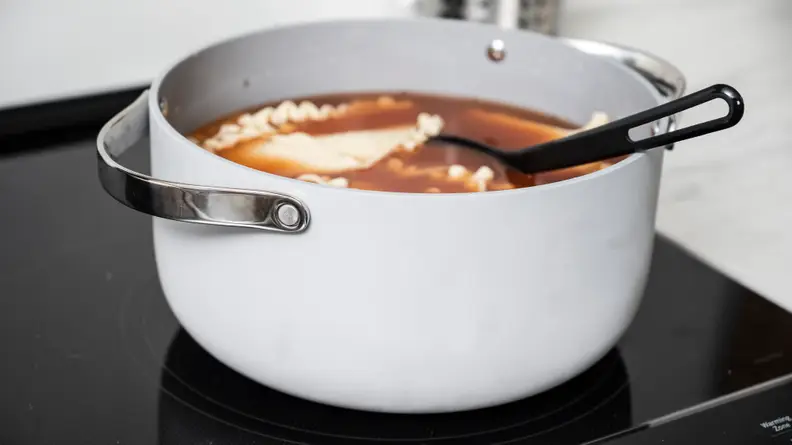 The rivets on the stock pot mean handles there's a slight chance the handles could come off.