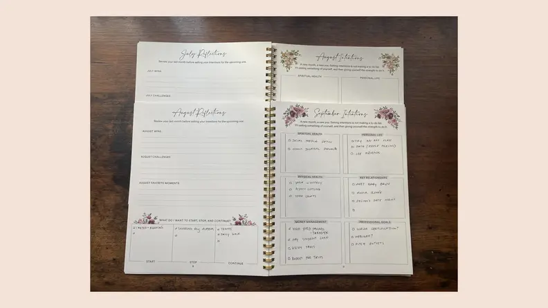 open journal on pink background