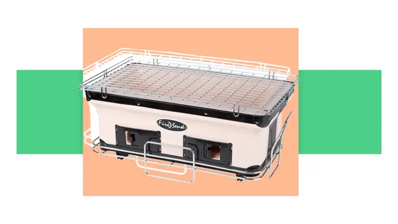 A portable Yakitori grill in front of a background.