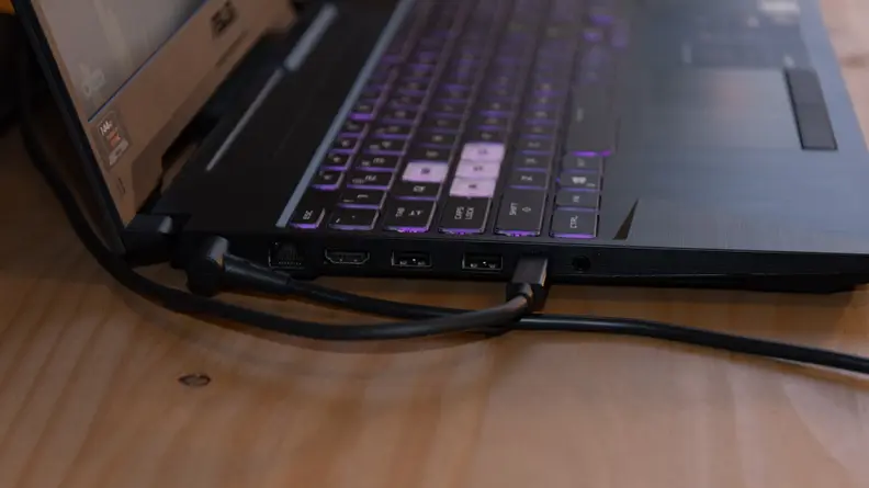A faraway view of the laptop from the side