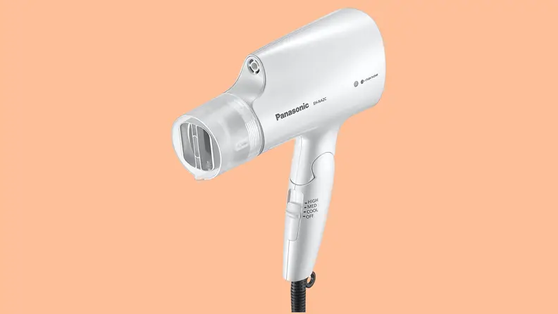 The Panasonic Nanoe hair dryer on an orange background.