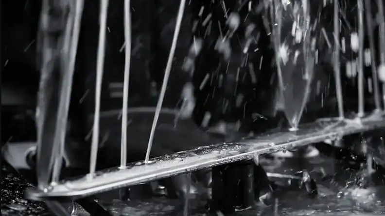 A spray arm shoots water