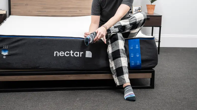 woman on edge of nectar mattress