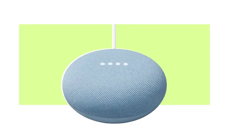 A Google Nest Mini smart speaker on a colorful background