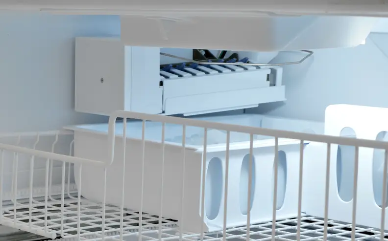 Cheaper French doors that don't have through-the-door dispensers will often include a basic ice maker like this one in the freezer.