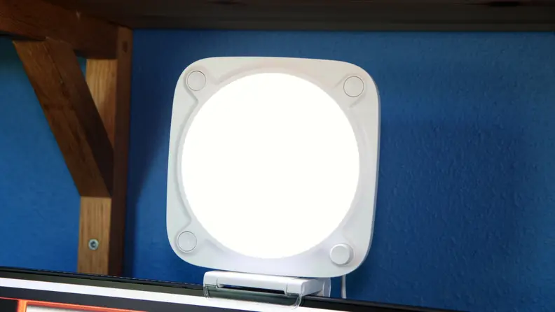 The Elgato Key Light Neo, a white, rounded square key light on top of a monitor