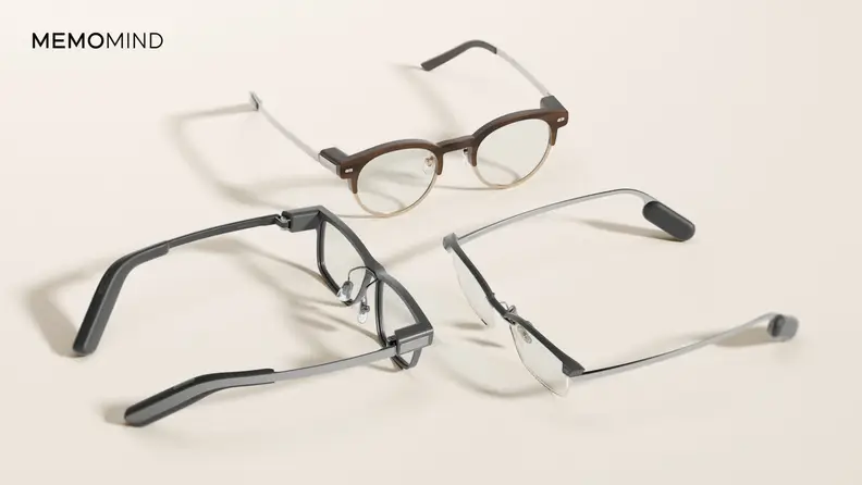 MemoMind One AI smart glasses shown in multiple frame styles with built-in heads-up display technology.