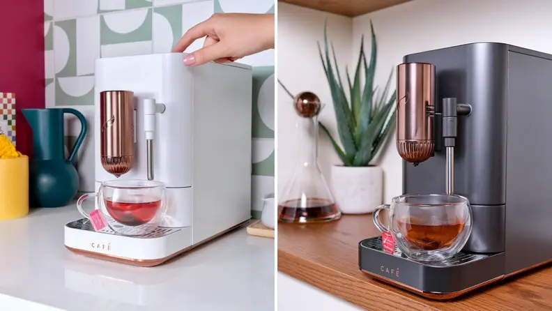 On left, Matte White Affetto machine with cup of tea under the spouts. On right, Matte Black Affetto with hot tea under the spouts.