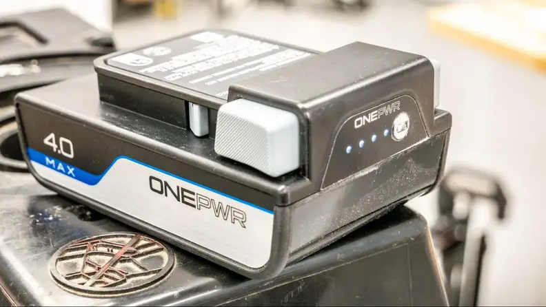 A Onepwr on a ladder displaying its power level