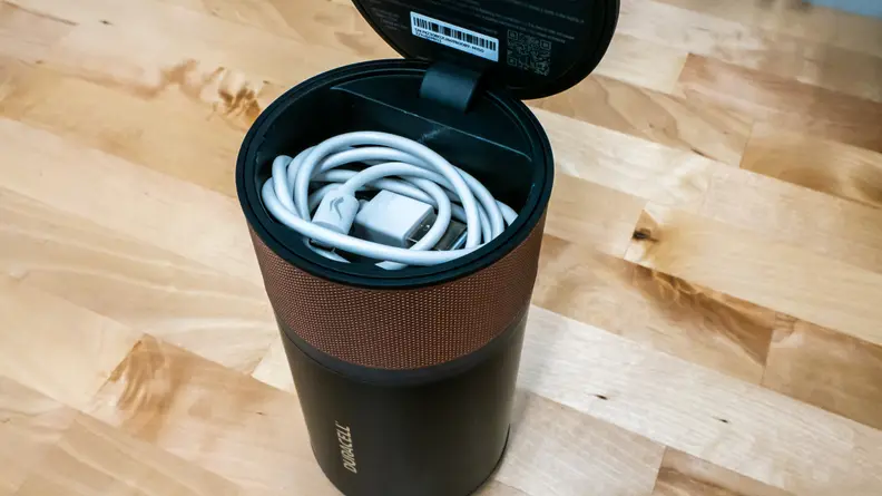 A coiled USB cable inside the Duracell M150.