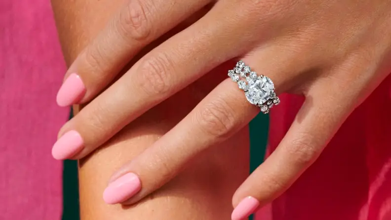 A close up of a Brilliant Earth diamond engagement ring on a hand.