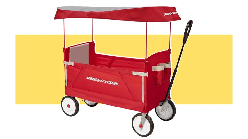 A red Radio Flyer outdoor wagon on a yellow background.