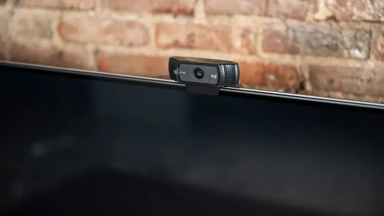 A close-up of an optional USB-connected webcam setup on top of the Fire TV Omni's panel