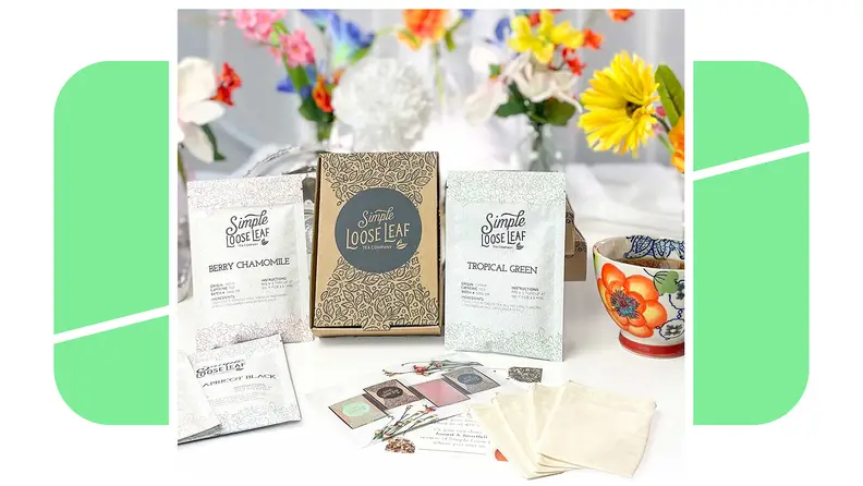 A subscription box of Simple Loose Leaf Tea Company products laid out next to flowers.