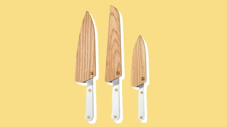 Wooden sheaths on top of Hedley & Bennett knives of different sizes.
