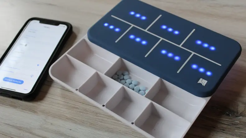 The lid has lights that indicate how many of each pill you need to take.