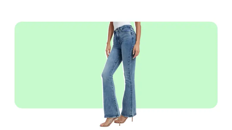 A pair of medium-wash flare leg jeans worn with a stiletto heel.