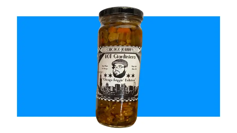 Jar of giardiniera on blue background