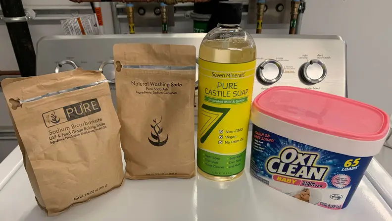 DIY laundry detergent recipe ingredients: Castile soap, baking soda, washing soda, OxiClean Baby