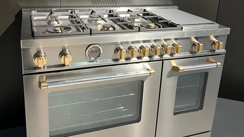 Stainless steel Bertazzoni range with gold hardware
