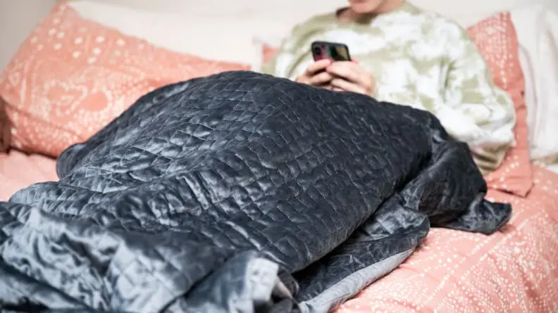 someone lies under the gravity blanket