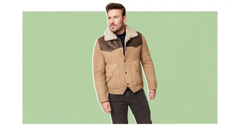 A model wearing a western style shearling jacket.