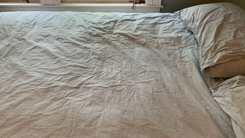 The Riley percale sheets are shown on a bed for testing.
