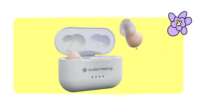 Audien Atom Pro 2 hearing aids on yellow background