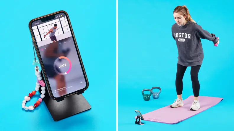 On left, smart phone perched on phone stand with FitOn app on screen. On right, person working out on top of yoga mat in front of smart phone.